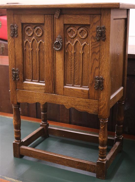 A Tudor style oak two door cupboard, W.51cm